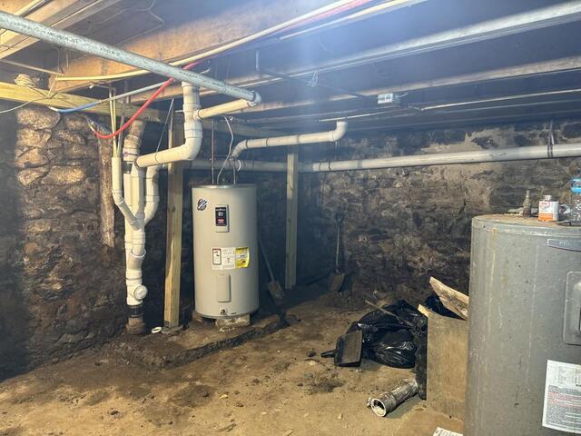 How We Waterproofed a Historic Basement Beneath a Barber Shop in <a href=