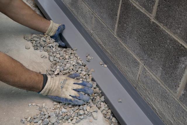 Installing a drainage track system in the basement