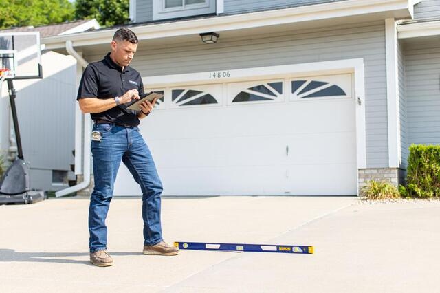 expert looking at table during concrete inspection