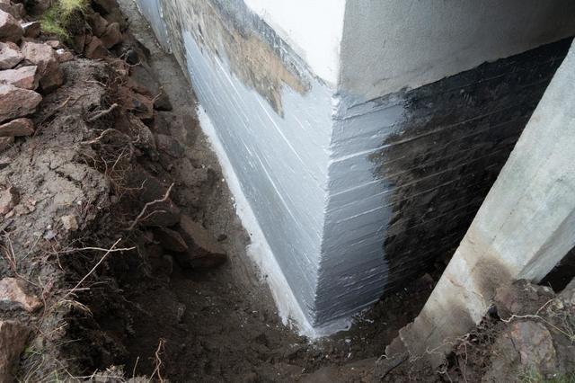 Ecavated soil around home for waterproofing