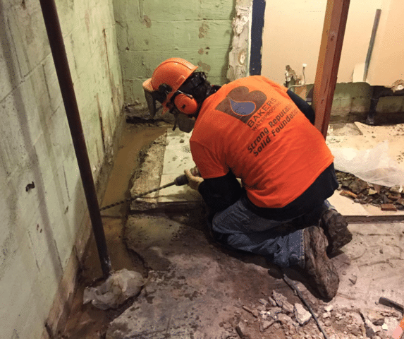 construction crewman drilling