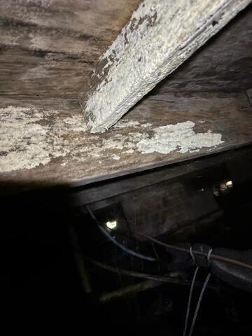 Moisture-related wood damage in crawl space beneath Indianola MS home.