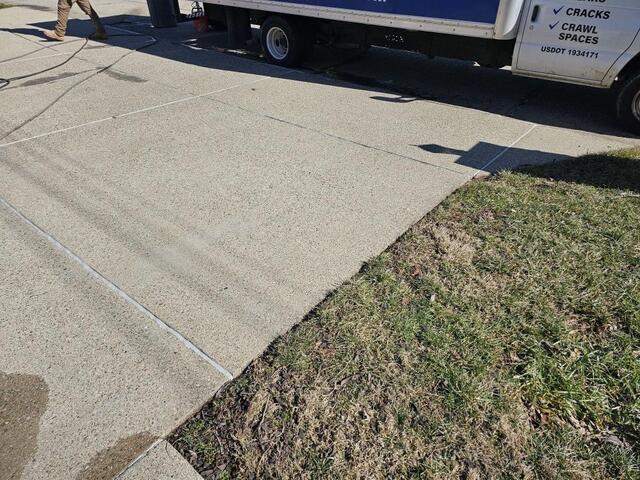 Lifted and repaired residential concrete driveway