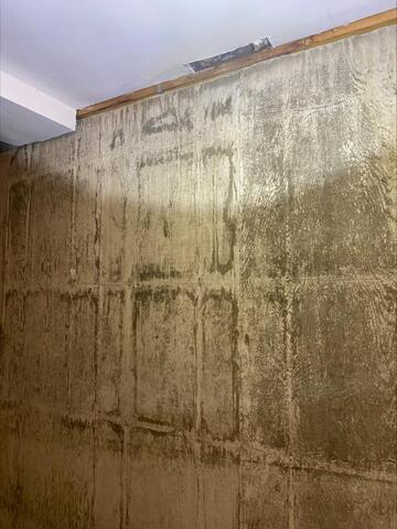 This basement photo, also taken by our Inspector Steve, shows water damage caused by leaks from the same southwest-facing doorway pictured earlier—demonstrating how exterior damage can lead to serious interior problems if not repaired promptly.