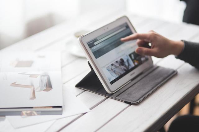 online reviews man on tablet