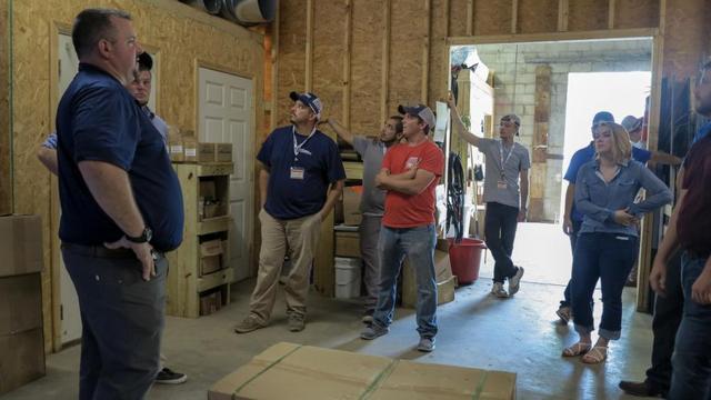 Production Project Manager Sean shows everyone around the warehouse which is where production begins.