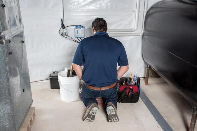 man inspecting basement
