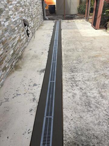 From Flooded Driveways to Dry Patios: The Power of Channel Drains in Tampa Bay - Image 2