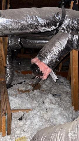 Damaged attic ductwork and insulation conditions inside a North Texas home showing ventilation and energy-efficiency concerns related to attic airflow performance.