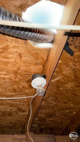 Attic ventilation issue in an Allen, Texas home showing visible daylight penetration and airflow exposure around roofing components inside the attic space.