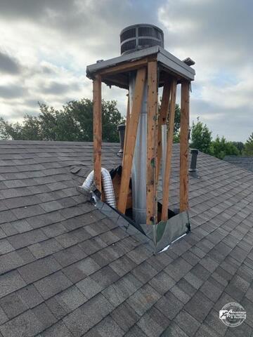 During the chimney restoration process, damaged exterior materials were removed to expose underlying structural components and deteriorated flashing areas. Proper repair and waterproofing help strengthen the roofing system and prevent future leaks.