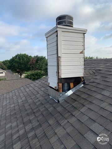 Before chimney repair work began, deteriorated siding and damaged roof flashing created vulnerable areas for water intrusion and roof leaks. Exposed chimney damage like this can eventually lead to structural roofing problems if left untreated.