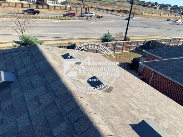 Completed asphalt roofing system overview following storm damage repairs and roof restoration work in Frisco TX.