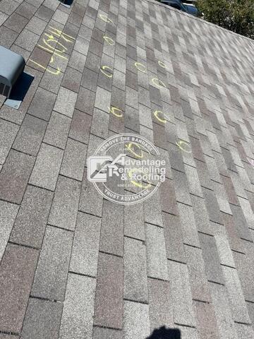 Professional roof inspection identifying hail impact damage on asphalt shingles in Frisco, Texas after severe storm activity.