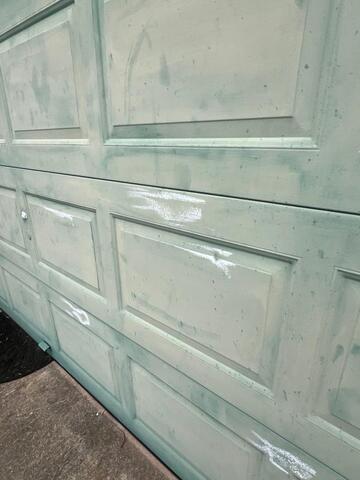 Broken exterior light fixture with visible impact damage documented during a residential storm damage inspection in McKinney, Texas.
