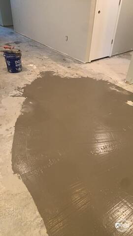 Completed hardwood flooring restoration after water damage repair inside a McKinney Texas home.