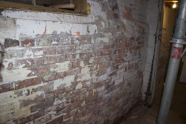 Before wall replacement. Brick wall repair.