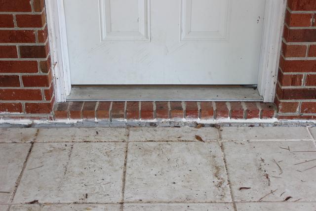 Before - large gap between slab porch and front door