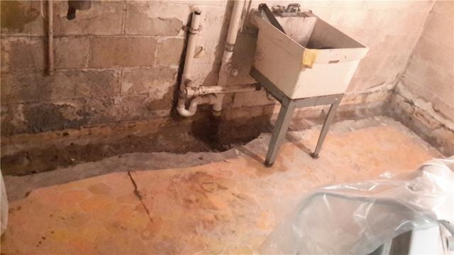 The water seepage created a musty environment in this Carbondale, Illinois homeowner's basement. Here our team has begun the preparation to install WaterGuard. Installing WaterGuard is minimally invasive, and the homeowner will no longer have to worry about a wet basement.