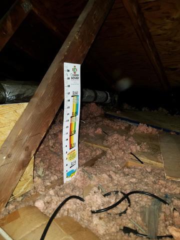 The existing attic insulation was only a few inches deep. This does not provide a good thermal barrier between the attic and the conditioned floor below.