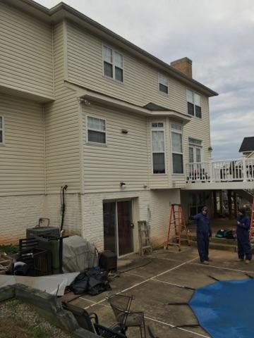 This Woodbridge, VA home had issues with cold drafts in the winter. Comfenergy crews are setting up to properly air seal and insulate the rear of this home.