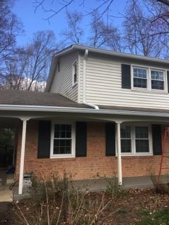 The finished product! New fascia boards, wrap, 6 in. gutters, 3 in. x 4 in. downspouts, and MasterShield!