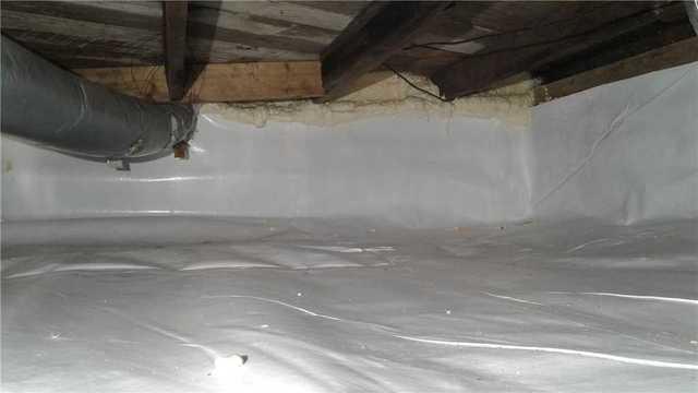 To remove the open access point for water or water vapor to get to the floor joists, we installed CleanSpace. CleanSpace is a waterproof liner that is thick and durable enough to keep all moisture out!