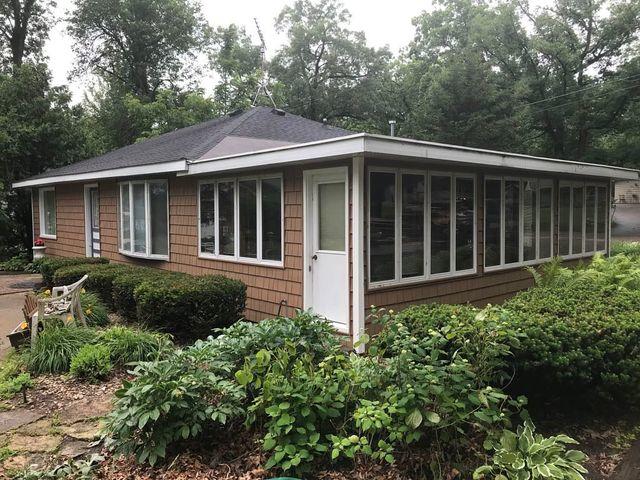 After Photo: The shake shingle siding keeps the look of wood without the maintenance.