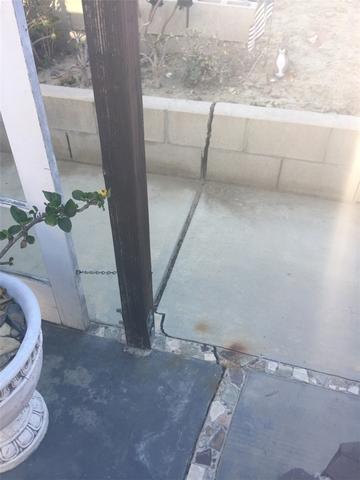 This Crack runs through the Block Wall, Patio, and the entire Slab Foundation of the Home.