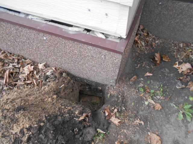 Before foundation repair. Part of the house separating from the foundation due to settling soil.