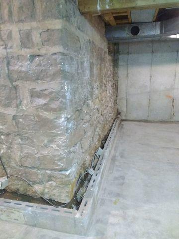 Before basement waterproofing.