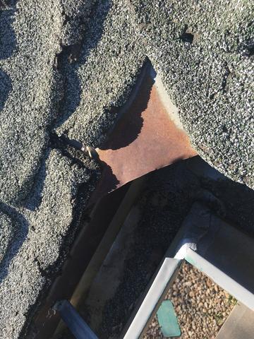 Deteriorating shingle and rusted exposed metal