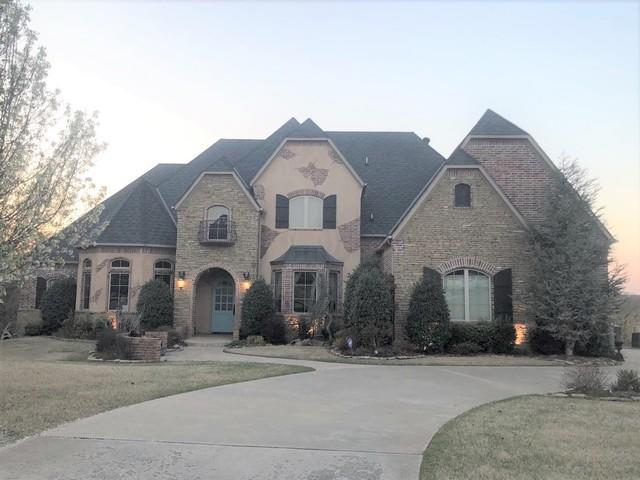 The home with the old shingles.