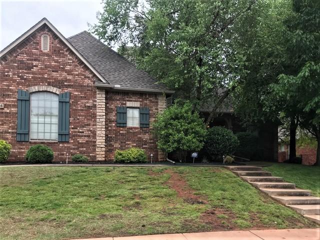 New gutters with leafguards and GAF ArmorShield II shingles in weathered wood.
