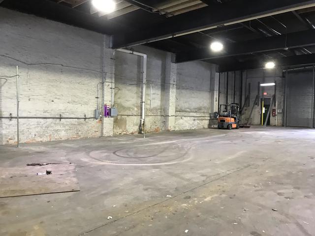 After shots of a warehouse cleaned out and broom swept. Baltimore MD.