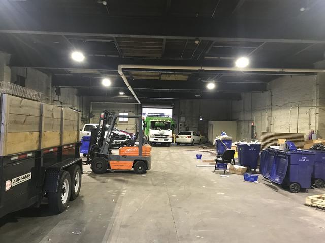Loading the heavy items with the fork lift.