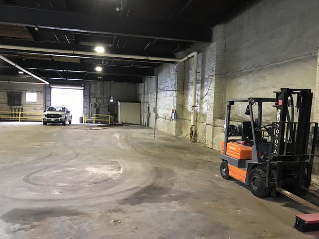 After shots of a warehouse cleaned out and broom swept. Baltimore MD.