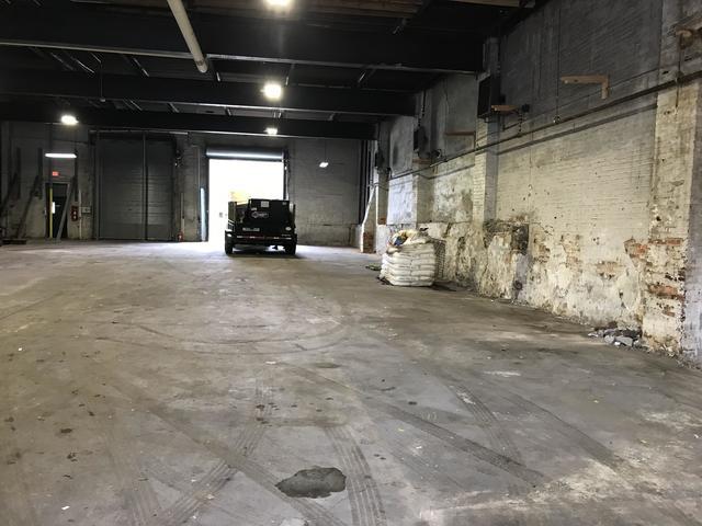 After shots of a warehouse cleaned out and broom swept. Baltimore MD.