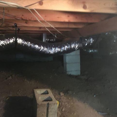 A leaning crawl space support. The result is a sagging floor above.