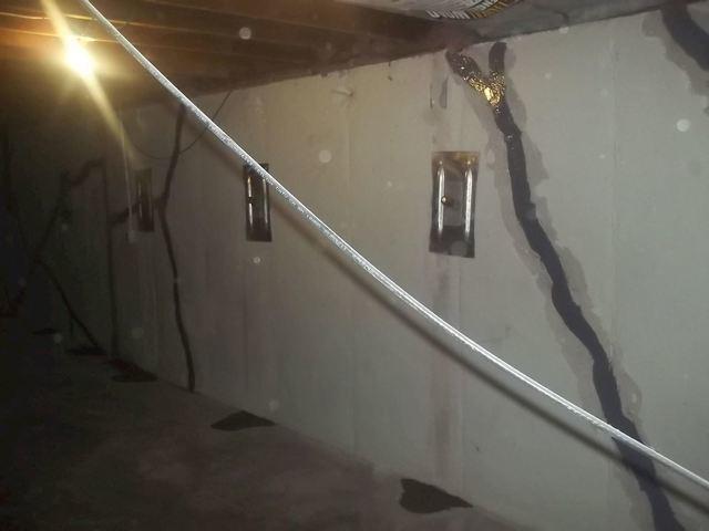 Foundation wall after it was straightened with helical wall tiebacks, a permanent structural solution.