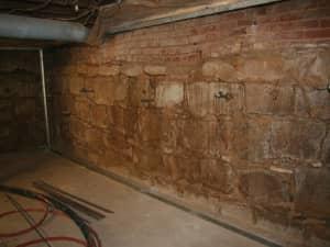 Before: deteriorating foundation wall.