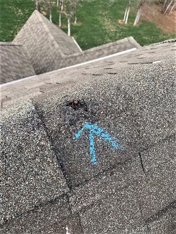 That had to be some big hail to make that hole.