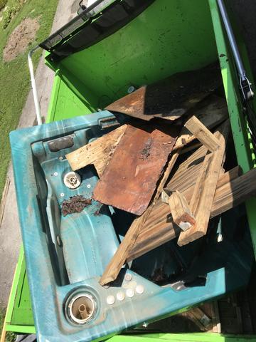 Junk hot tub in truck.