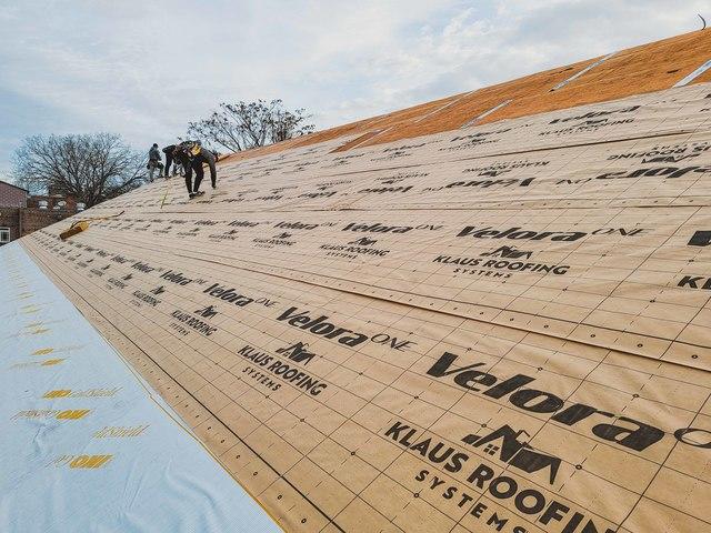 Ice and water membrane being installed