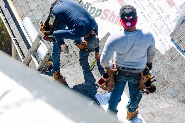 Our crew is installing the new roofing shingles.