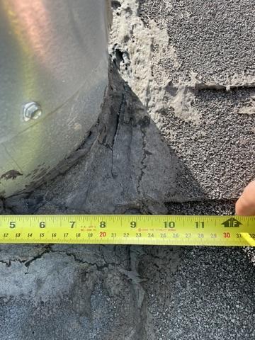 Additional cracking around vent pipe base.