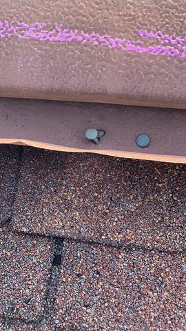 Old-Style Metal Ridge vent. Nails pulling out of roof deck.