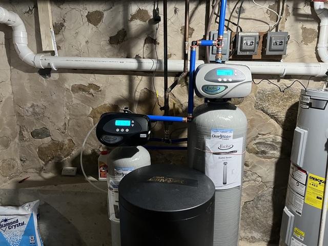 New water softener (left) and sulfur filter (right)