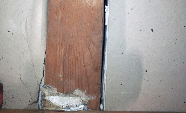 We can see a large ¼ - ½ inch gap along the sill plate. Air is leaking from the conditioned rooms into the attic.