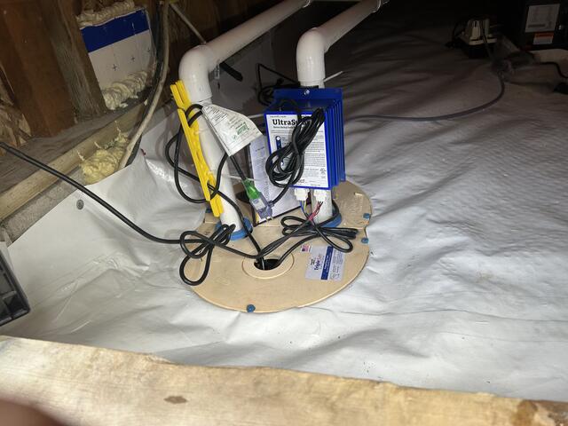 After image showing CleanSpace with Triple Safe Sump Pump with discharge line.